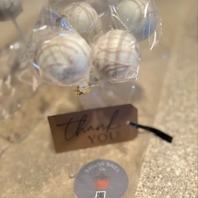 Cake pops wrapped with a thank you tag