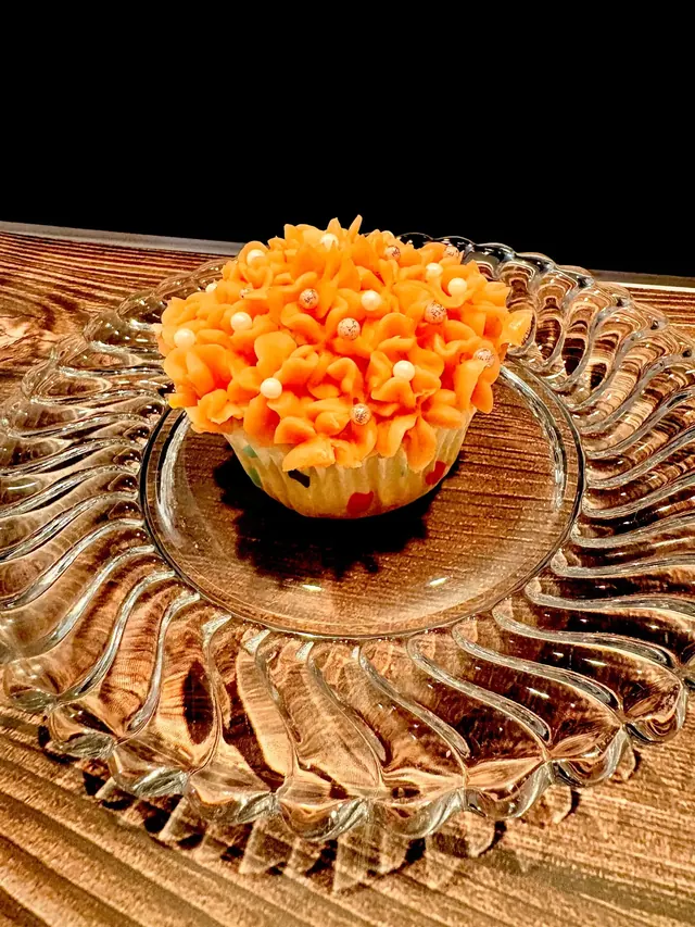 Orange buttercream hydrangea cupcake